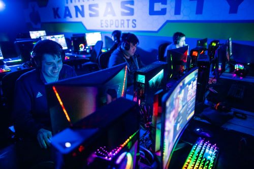students sit in front of monitors to game in the esports studio