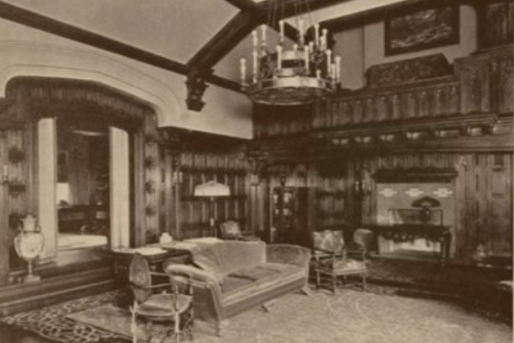 Living room, or Great Hall, of the Epperson House in 1926- shown: organ loft, hanging chandelier, and area fully furnished