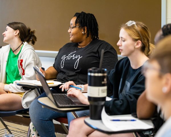 Students sit in a classroom