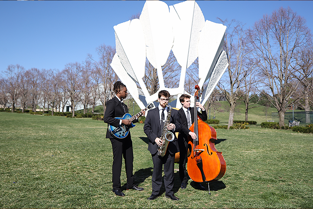 A group of musicians performing in front of a shuttlecock
