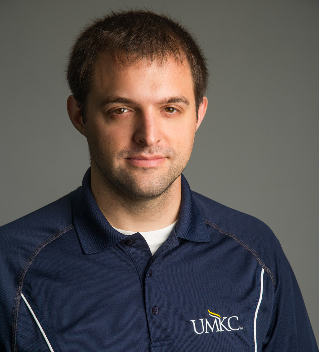Anthony Maly wears a collared UMKC shirt