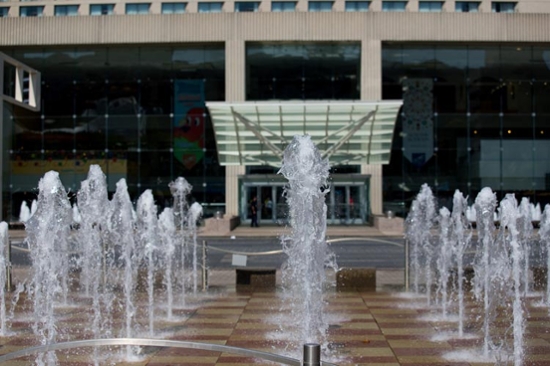 fountains surge upward in front of Crown Center