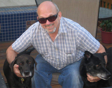 Larry with his dogs