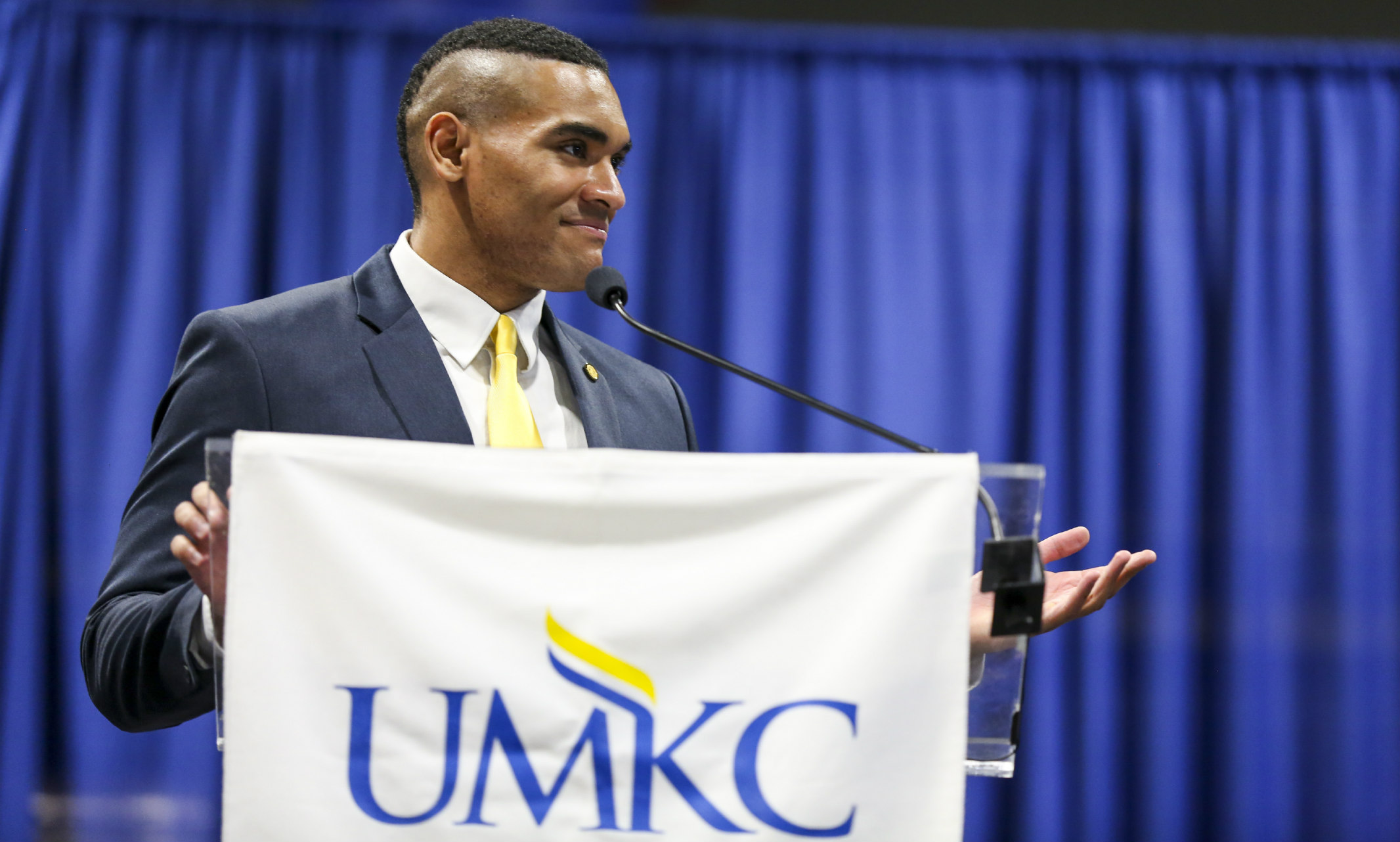 UMKC Student President Justice Horn stands at a podium