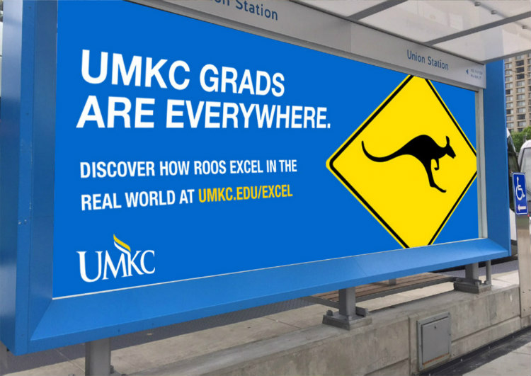 UMKC Grads Are Everywhere sign at a Kansas City streetcar stop