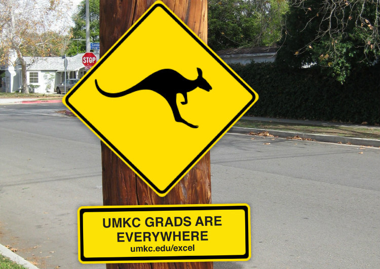 Yellow sign with a kangaroo silhouette that says UMKC Grads are Everywhere.