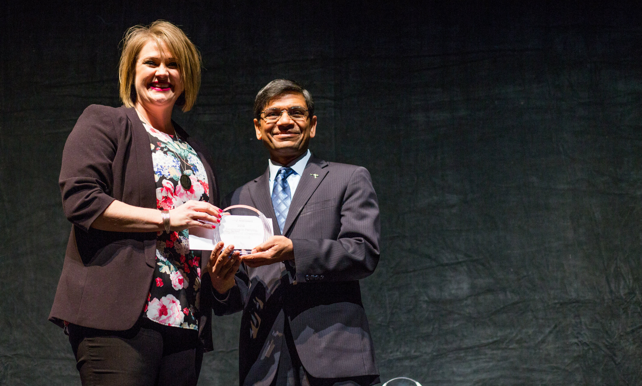 Staff award recipient receives award from Chancellor Mauli Agrawal