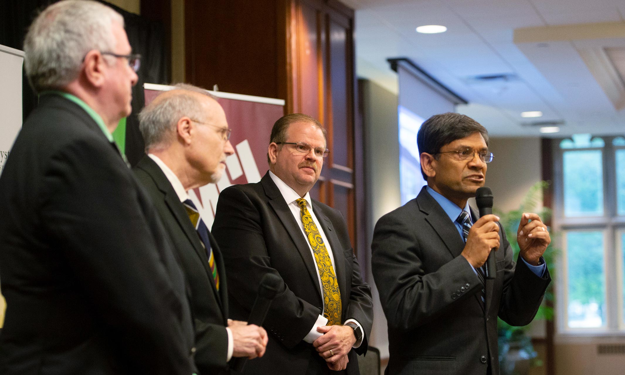 UMKC Chancellor Mauli Agrawal, pictured on the right, addresses the crowd at the Precision Medicine announcement event