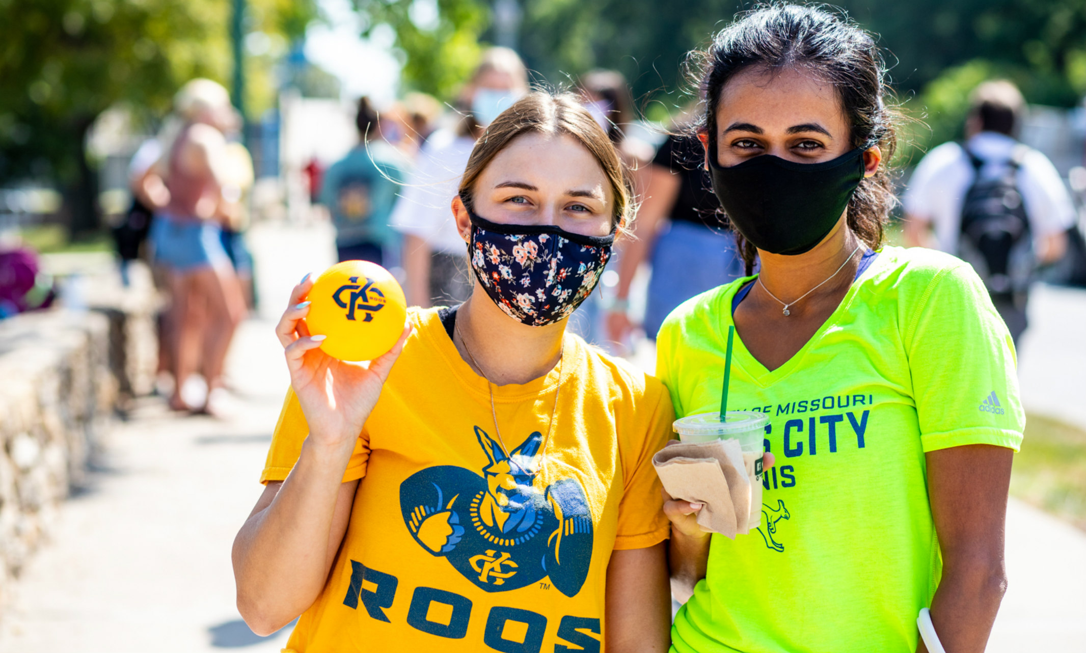 Two girls wearing masks.