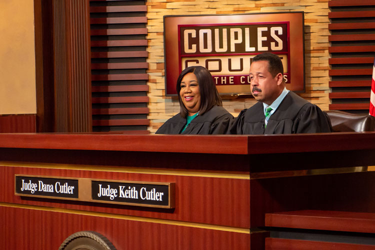 The Cutlers in the tv courtroom where they shoot their television show, Couples Court with the Cutlers