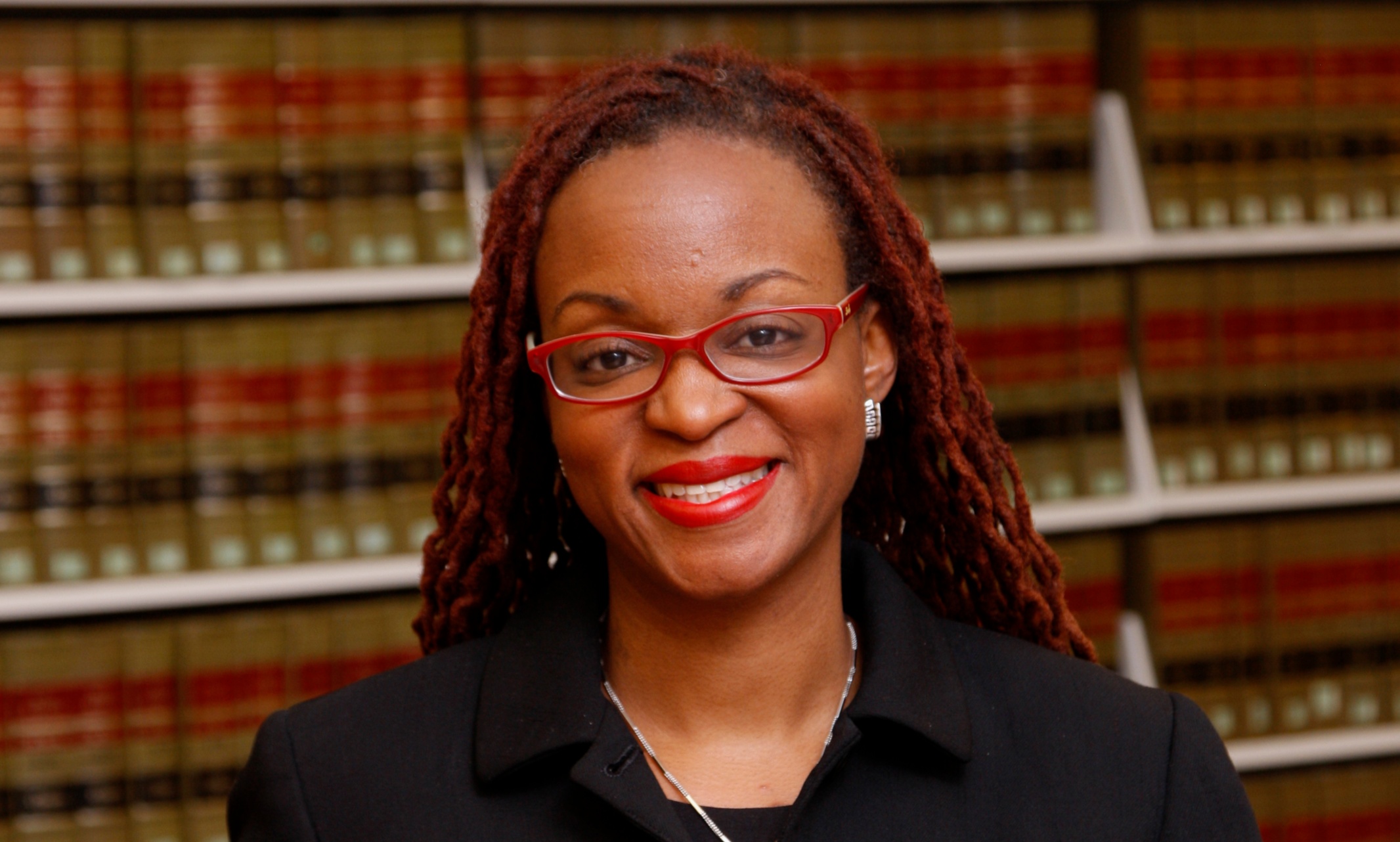 Jamila Jefferson-Jones portrait taken in a law library
