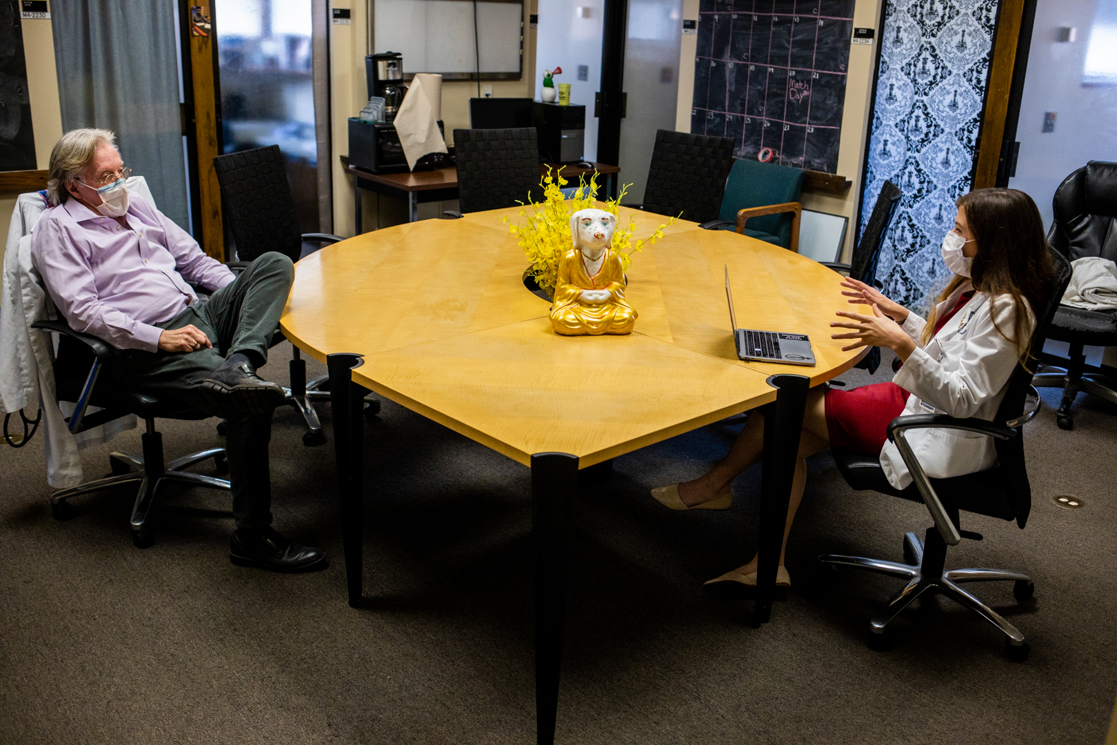 David John and Faith Mueller talk in their Gold 1 docent unit space.