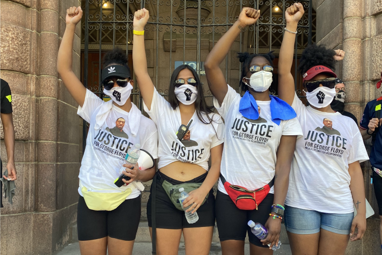 protest-organizers-raising-fists.png