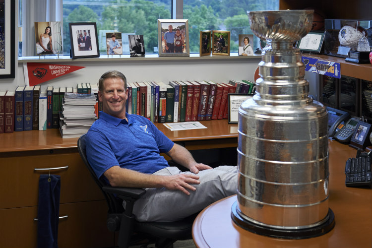Matt Matava in his office with the Stanley Cup.
