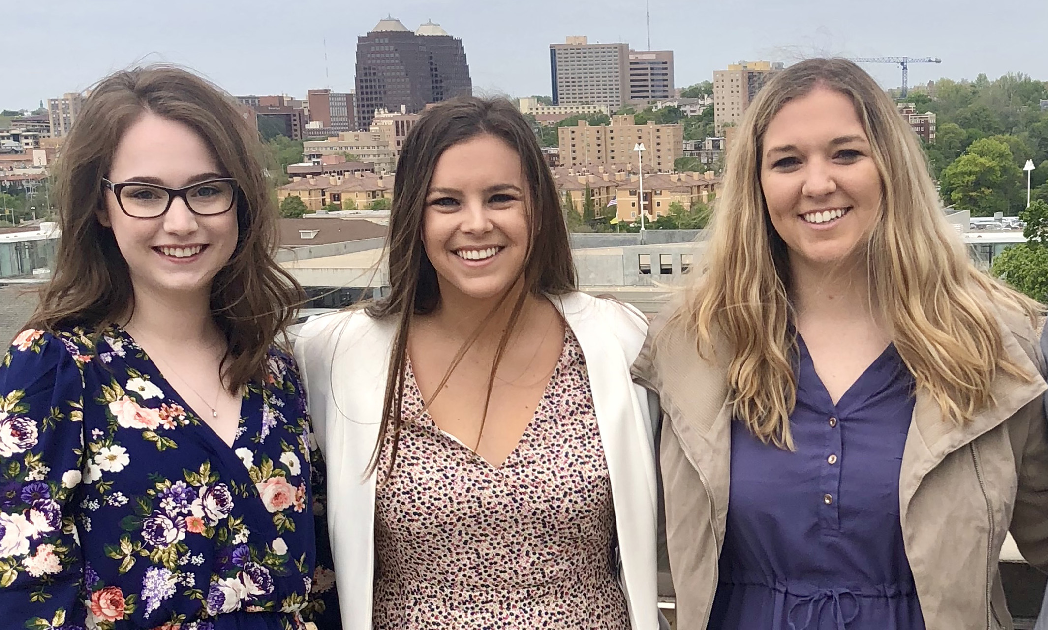 three students standing for a pic