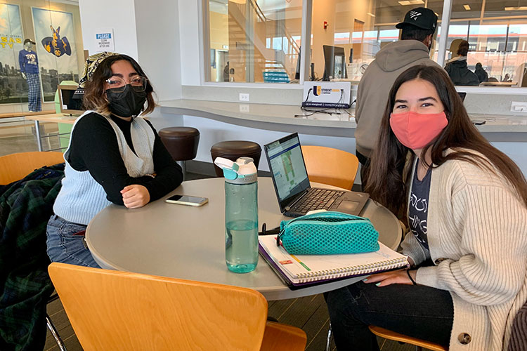 Masked students in the student union