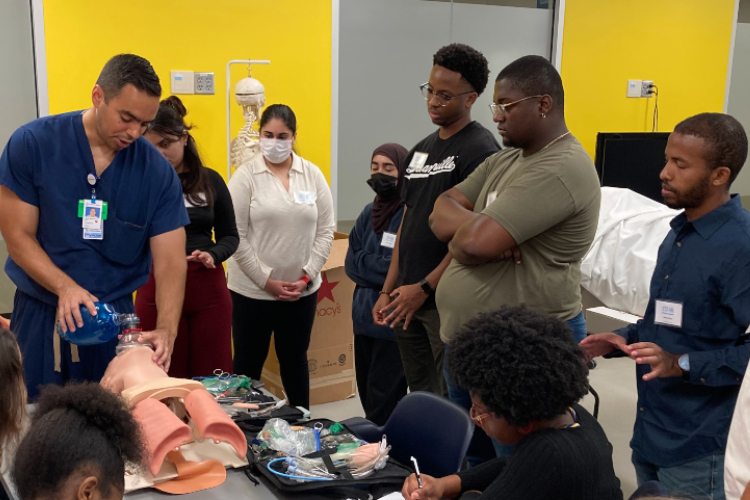 2022 class of Summer Scholars view an intubation demonstration.