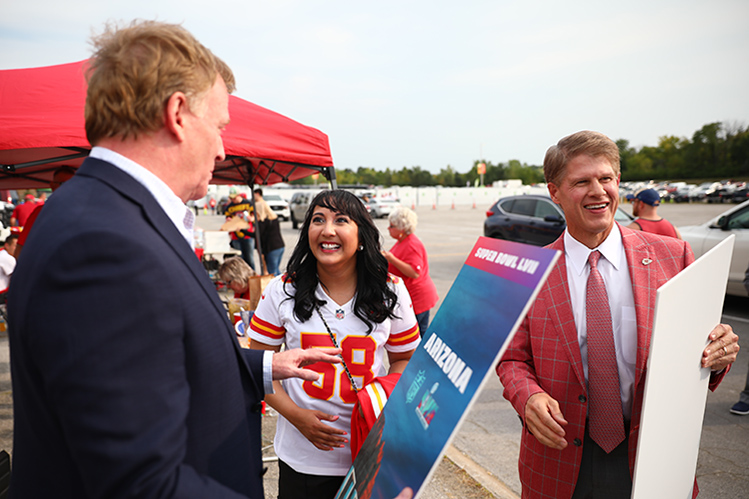 UMKC School of Medicine alumna Amy Patel with NFL Commissioner Rogerl Goodell and Kansas City Chiefs owner Clark Hunt.