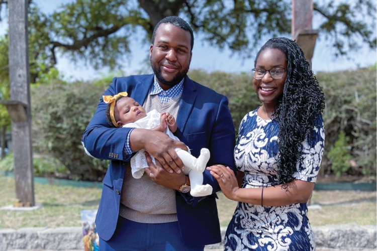 (Left to right) Chizitam Ibezim holding his infant daughter with his wife, Ginika Ibezim