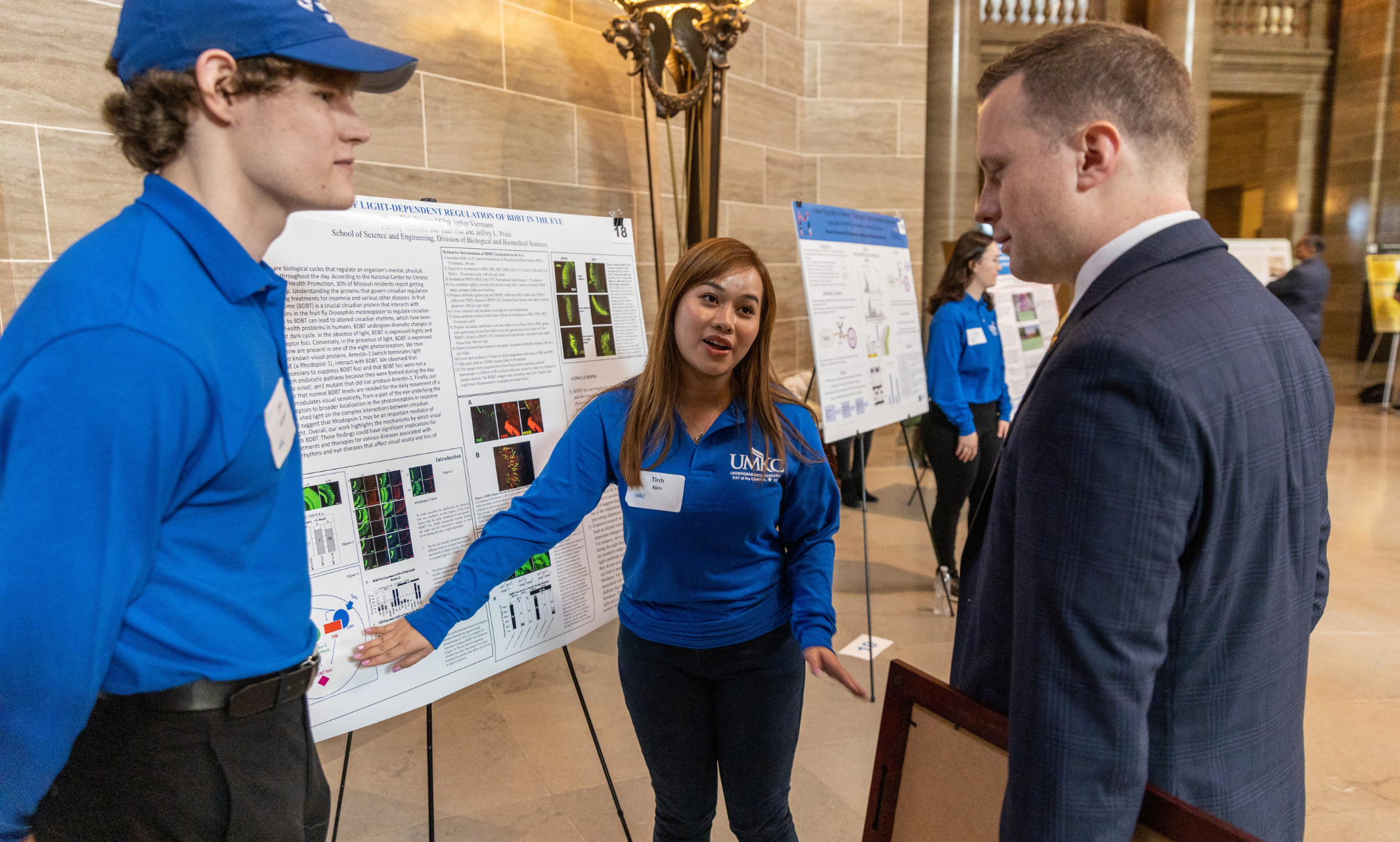 Sophomore Chris Viermann and Senior Tinh Nim present their research at the Missouri State Capitol