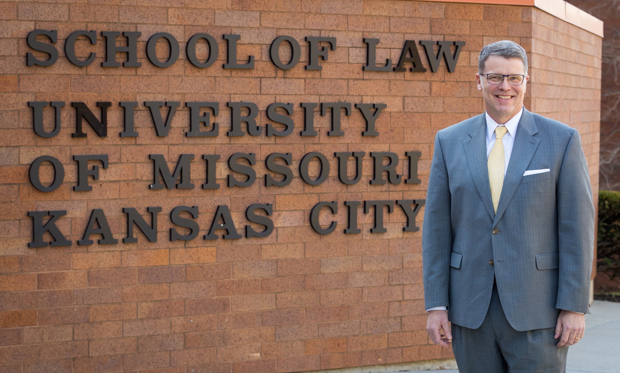 Lou Mulligan stands in front of the UMKC School of Law building