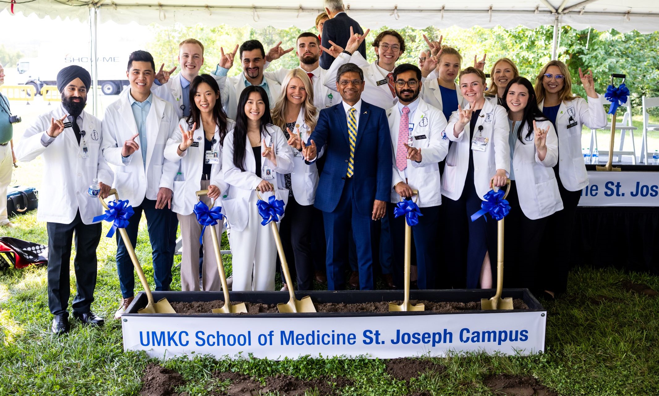 Chancellor Agrawal and approximately 15 medical students participate in a groundbreaking ceremony
