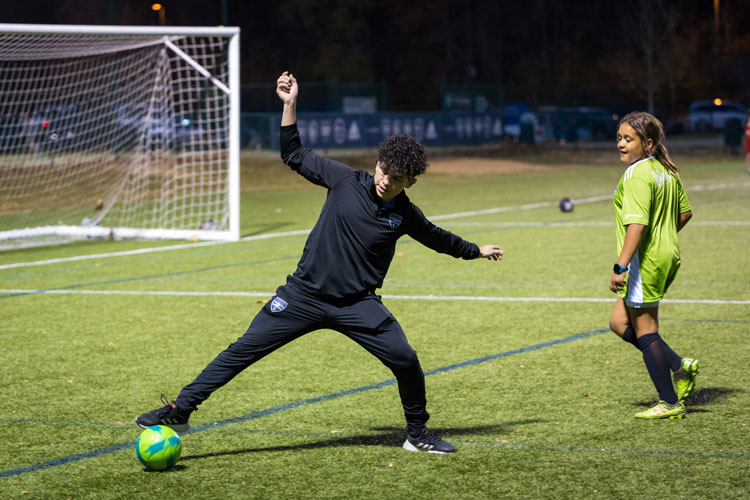 Edgardo Leiva kicks soccer ball