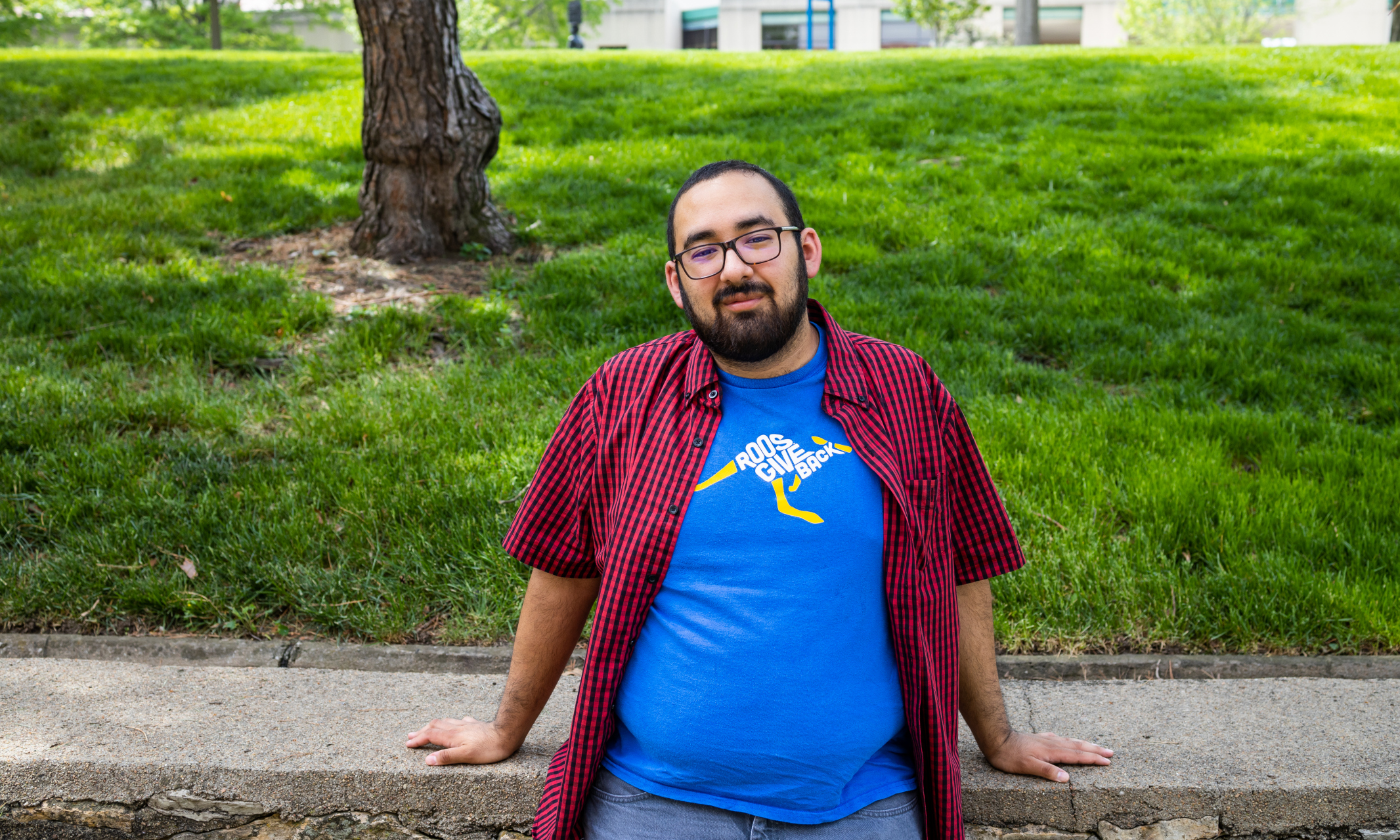 Researcher Alejandro Cervantes, dressed casually in an outdoor campus setting