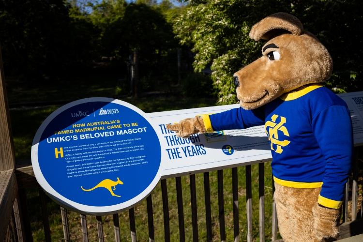 KC Roo points to UMKC signage at Bluey's deck in the Australia section of the Kansas City Zoo