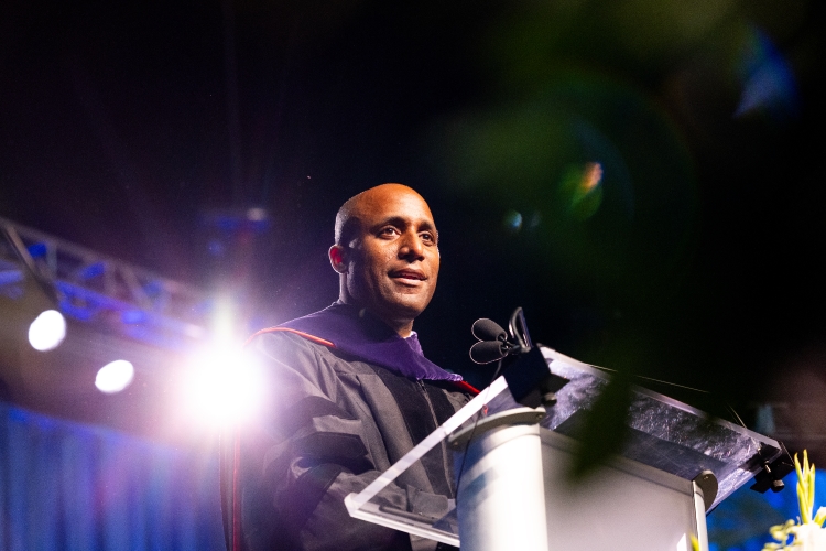 Mayor Quinton Lucas speaks on stage at Commencement