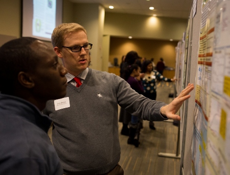 Two faculty members discussing a research project.