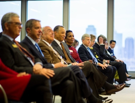 UMKC Trustees sit and listen to a speaker at an annual trustees awards ceremony.