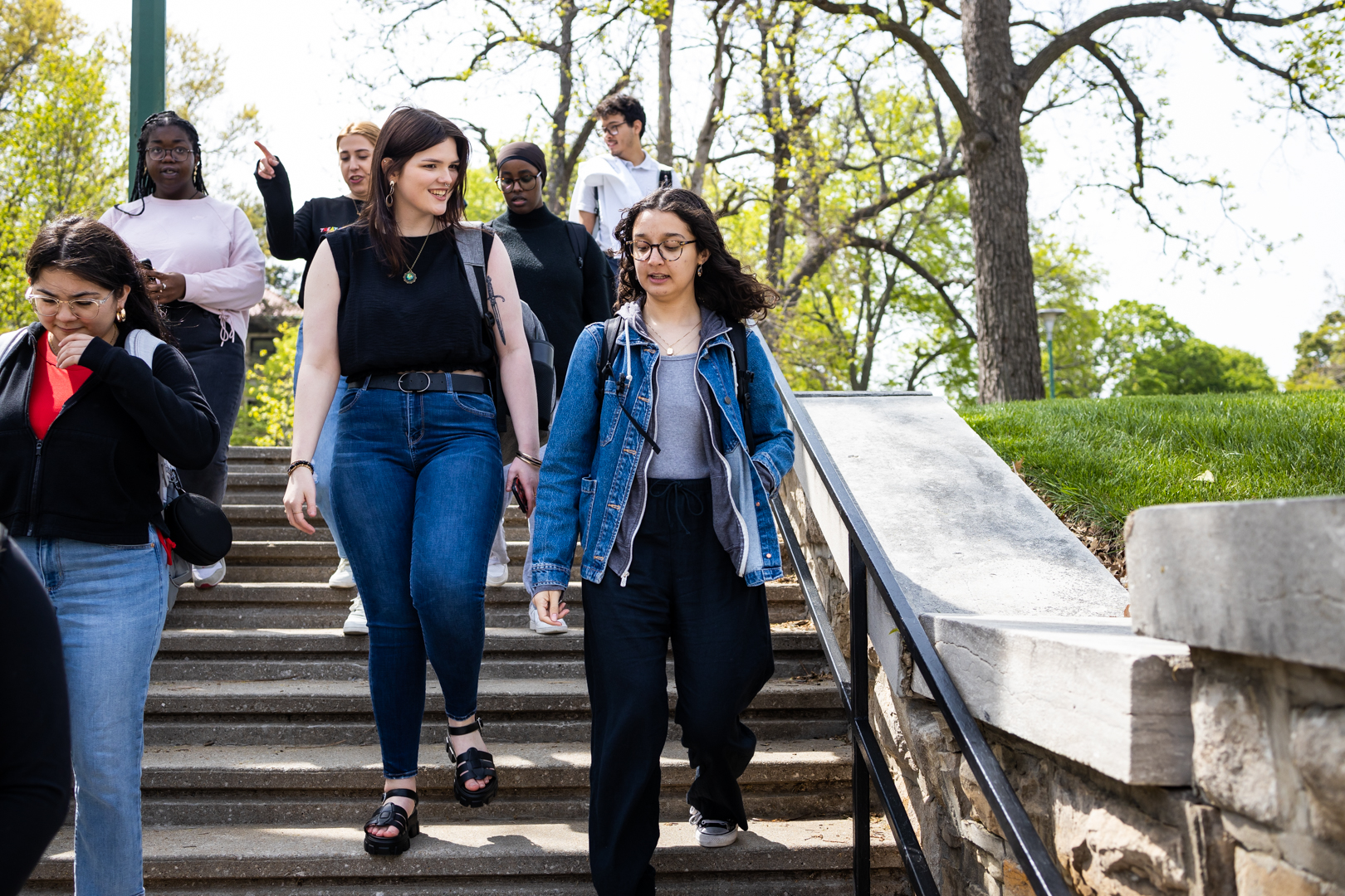 students walking down an outdoor staircase